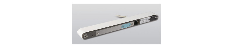 Conveyors with linear integrated motor with optical window